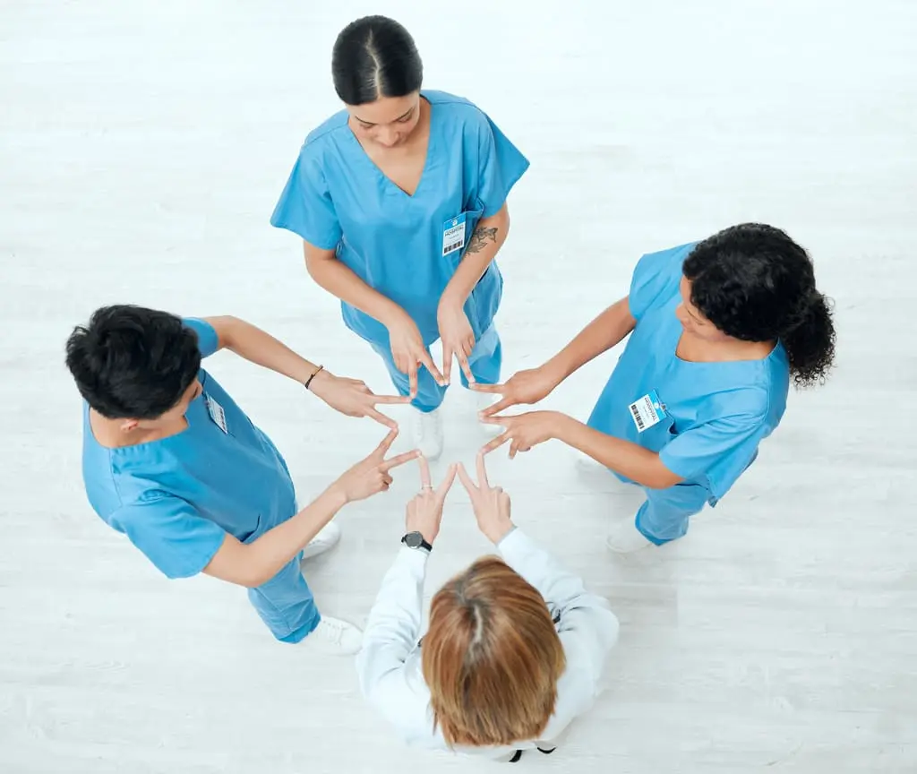 nurses making a star with their index fingers